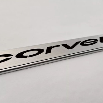 ACC® - GM Licensed Series Brushed License Plate Frame with Black Solid Corvette Logo