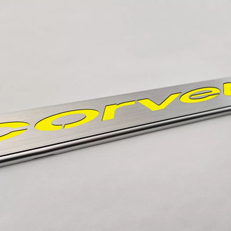 ACC® - GM Licensed Series Brushed License Plate Frame with Yellow Solid Corvette Logo