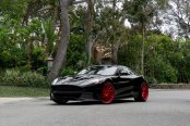 Black Aston Martin Rapide Rocking a Set of Contrasting Red Rims