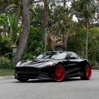 Custom Front Lip on Black Aston Martin Rapide - Photo by Forgiato