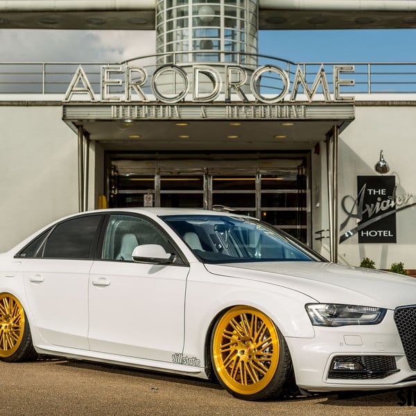 Custom White Audi A4 with Gold Wheels - Photo by Vossen