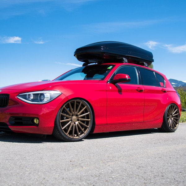 Red BMW 1-Series with Roof Cargo Box - Photo by Vossen
