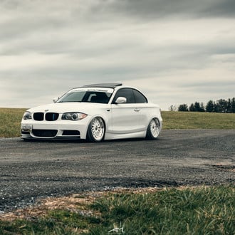White Lowered BMW 1-Series with Custom Wheels - Photo by Arlen Liverman
