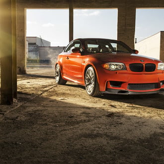 Carbon Fiber Front Lip on Orange BMW 1-Series - Photo by Vorstiner