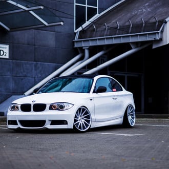 Cute White BMW 1-Series on Chrome Buttoms