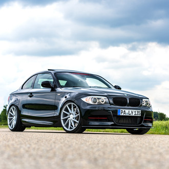 Gloss Black BMW 1-Series with Aftermarket Front Bumper Cover - Photo by Vossen