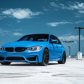 Blue BMW 3-Series with Custom Halo Headlights - Photo by Velgen