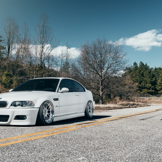 Front Bumper with Fog Lights on White BMW 3-Series - Photo by Arlen Liverman