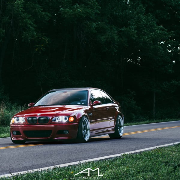 Red BMW 3-Series with Blacked Out Grille - Photo by Arlen Liverman