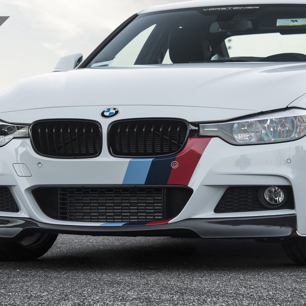 White BMW 3-Series with Aftermarket Projector Headlights - Photo by Vorstiner