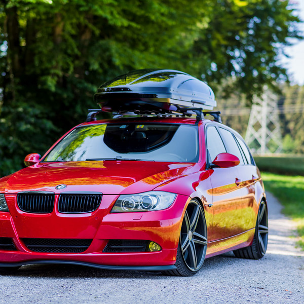 Lowered Red BMW 3-Series with Roof Cargo Box - Photo by Vossen