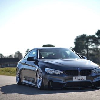 Asphalt Gray BMW M4 with Crystal Clear Headlights - Photo by Rotiform