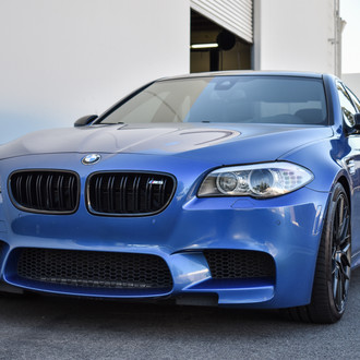 Blue BMW 5-Series with Aftermarket Halo Headlights - Photo by Vorstiner