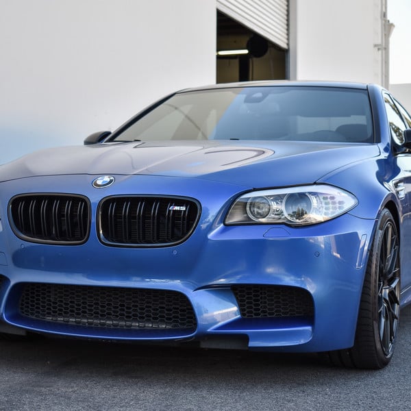 Blue BMW 5-Series with Aftermarket Halo Headlights - Photo by Vorstiner