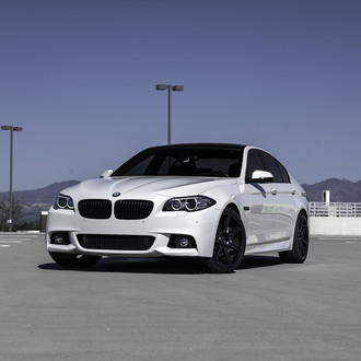 Front Bumper with Fog Lights on White BMW 5-Series - Photo by Zito Wheels