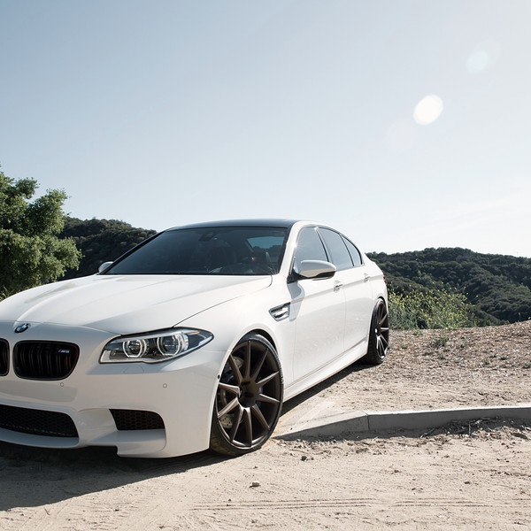 White BMW 5-Series with Crystal Clear Halo Headlights - Photo by Zito Wheels