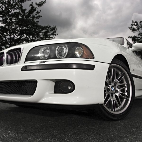 White BMW 5-Series with Aftermarket Headlights - Photo by dan kinzie