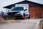 Custom Red JR Wheels As a Focal Point on Black BMW 5-Series