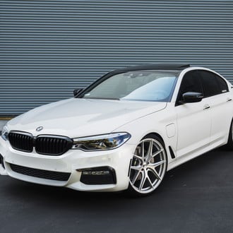 White BMW 5-Series with Aftermarket Front Bumper - Photo by Avant Garde Wheels