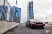 When Style Meets Performance: Cherry Red BMW 5-Series Rolling On Glossy Black Wheels