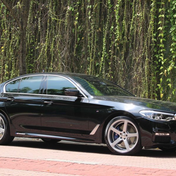 Black BMW 5-Series with Custom Chrome Trim - Photo by Vossen