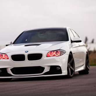 Custom Front Bumper with Fog Lights on White BMW 5-Series - Photo by Vossen