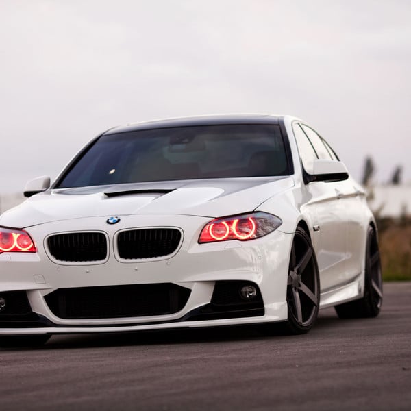 Custom Front Bumper with Fog Lights on White BMW 5-Series - Photo by Vossen