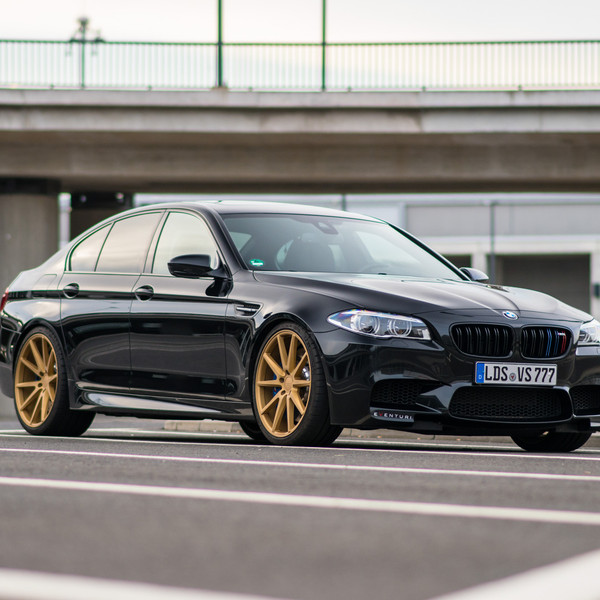 Black BMW 5-Series with Custom Front Bumper - Photo by Vossen