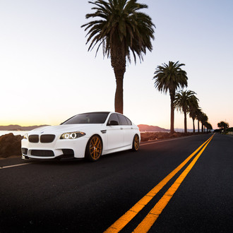White BMW 5-Series with Custom Halo Headlights - Photo by Avant Garde Wheels