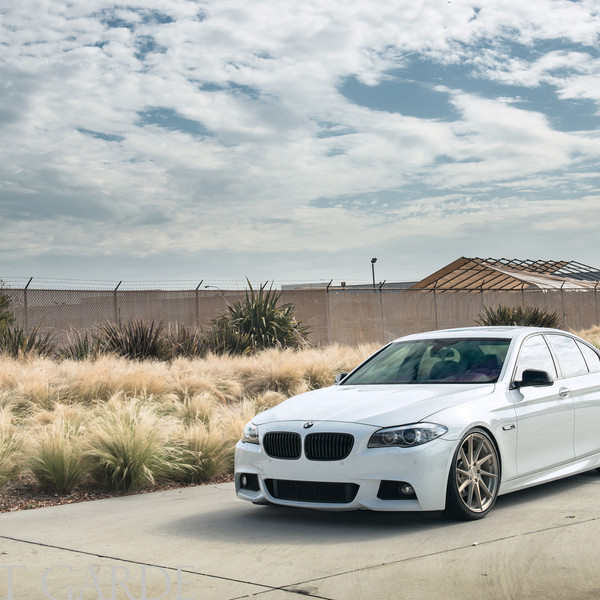 Front Bumper with Fog Lights on White BMW 5-Series - Photo by Avant Garde Wheels