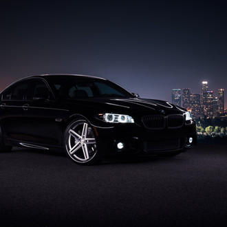 Front Bumper with Fog Lights on Black BMW 5-Series - Photo by Concept One