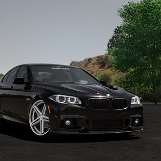 Black BMW 5-Series with Custom Halo Headlights - Photo by Concept One