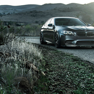 Custom Front Lip on Black BMW 5-Series - Photo by Vorsteiner