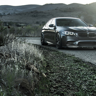 Black BMW 5-Series with Custom Front Lip - Photo by Vorstiner