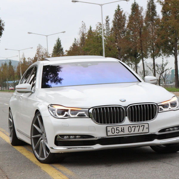 White BMW 7-Series with Custom LED Halo Headlights - Photo by Vossen