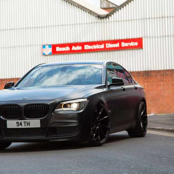 Black BMW 7-Series with Custom LED Headlights - Photo by Vossen