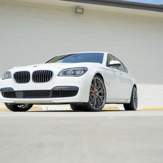 Dark Smoke Headlights on White BMW 7-Series - Photo by Vorsteiner