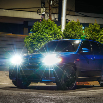 Aftermarket Projector Headlights on Blue BMW X5 - Photo by Vossen