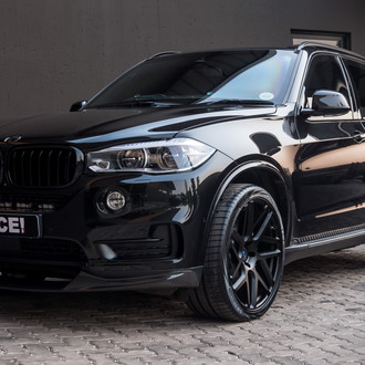 Carbon Fiber Front Bumper Lip on Black BMW X5 - Photo by Vossen