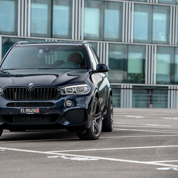 Black BMW X5 with Custom Front Bumper Cover - Photo by Vossen