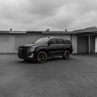 Black Niche Wheels With Yellow Accents on Cadillac Escalade