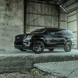 Aftermarket Headlights on Black Cadillac Escalade - Photo by Completed Customs