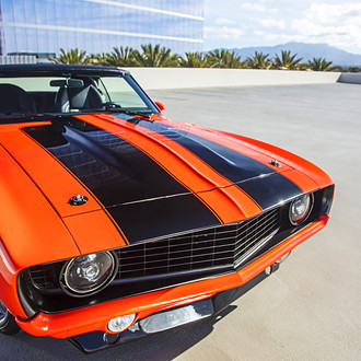 Custom Orange Chevy Camaro with Black Stripes - Photo by Tim Sutton