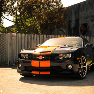 Race Look of Custom Black Chevy Camaro SS with Orange Stripes