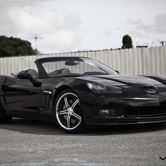 Menacing Black Convertible Chevy Corvette Sporting Custom Chrome Vossen Wheels