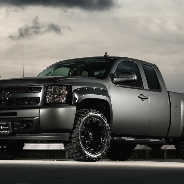 Lifted customized Chevy Silverado with tinted window - Photo by Exclusive Motoring