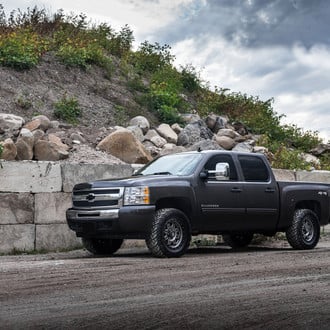 Lifted Chevy Silverado with Chrome Grille - Photo by Fuel Offroad