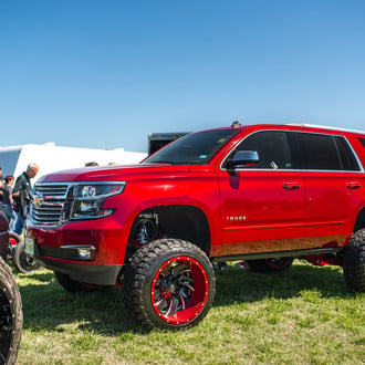 Red Chevy Tahoe with Fox Suspension Kit - Photo by Fuel Offroad