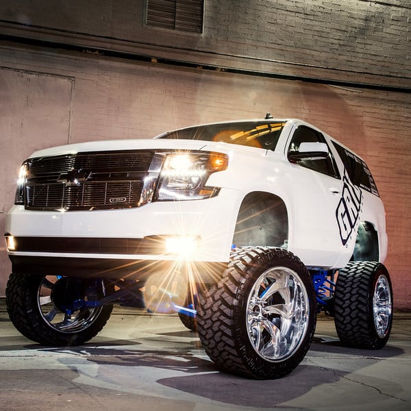 Blacked Out Billet Grille on White Lifted Chevy Tahoe - Photo by Grid Off-Road