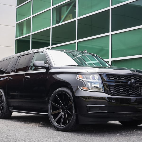 All Black Chevy Suburban on Custom Wheels - Photo by Exclusive Motoring
